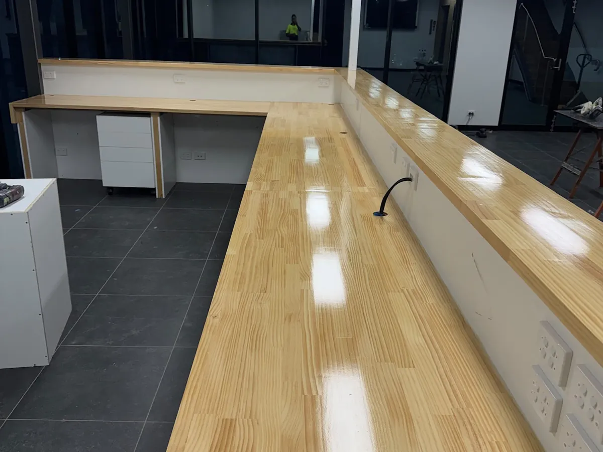 Glossy timber-finished commercial reception counter