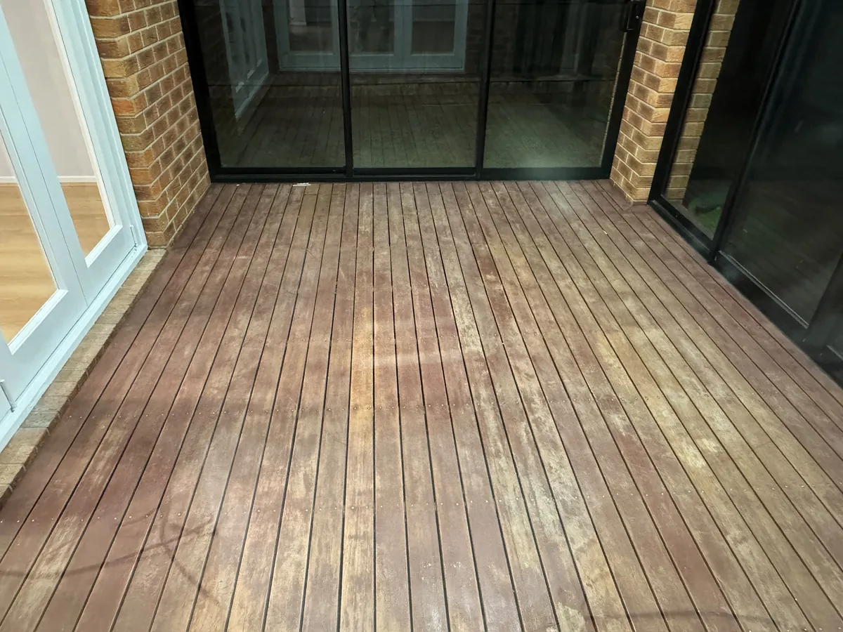 Timber deck under a covered pergola, freshly finished